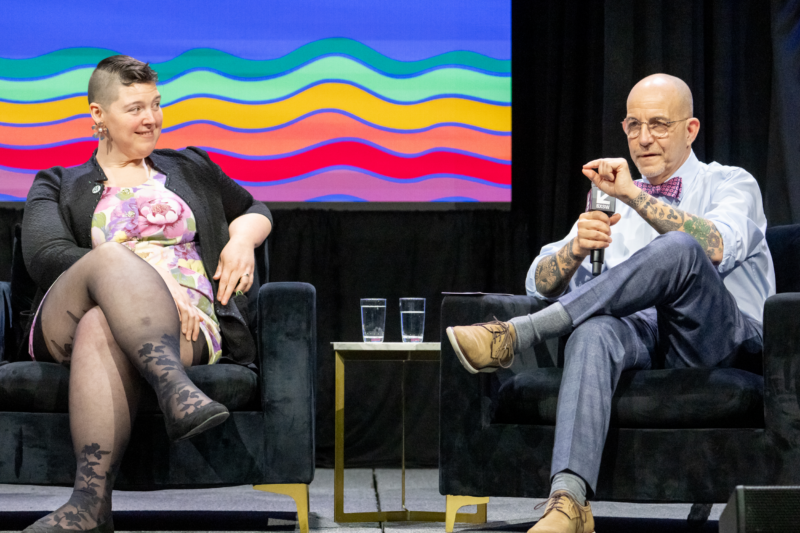 President of the American Library Association Sam Helmick, seated left, and PFLAG National CEO Brian K. Bond, seated right, look animated as they discuss the effects of bans from the stage at SXSW EDU.
