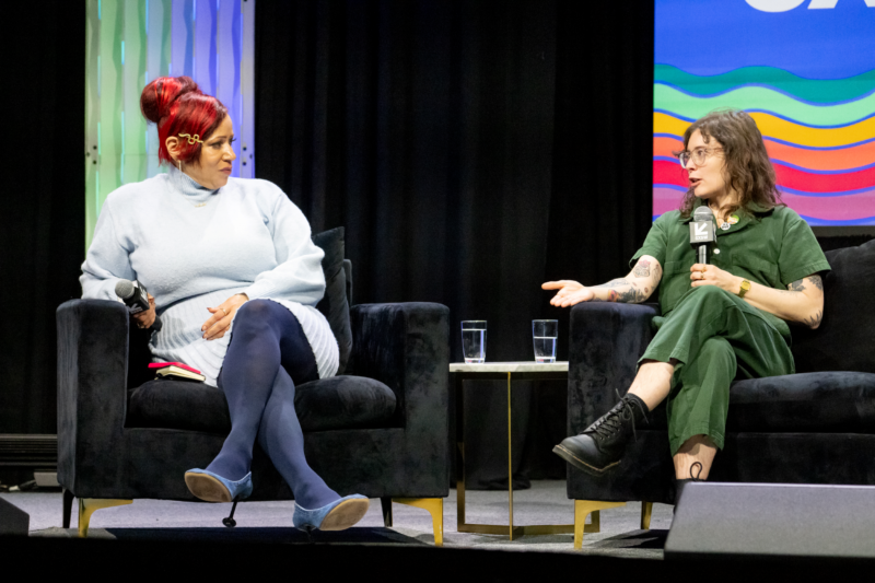 Authors of banned books Nicole Hannah-Jones, seated left, and Casey McQuiston, seated right, look at each other as they discuss the effects of bans from the stage at SXSW EDU.