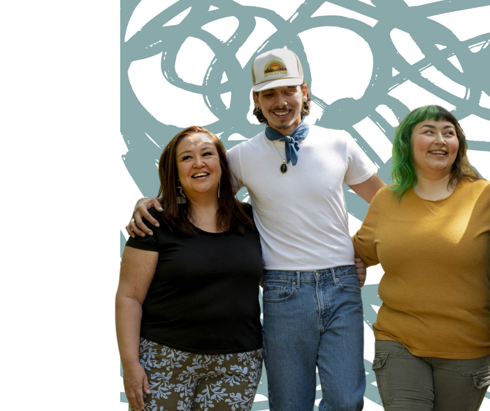 Three Indigenous people smiling and standing together with arms around each other.